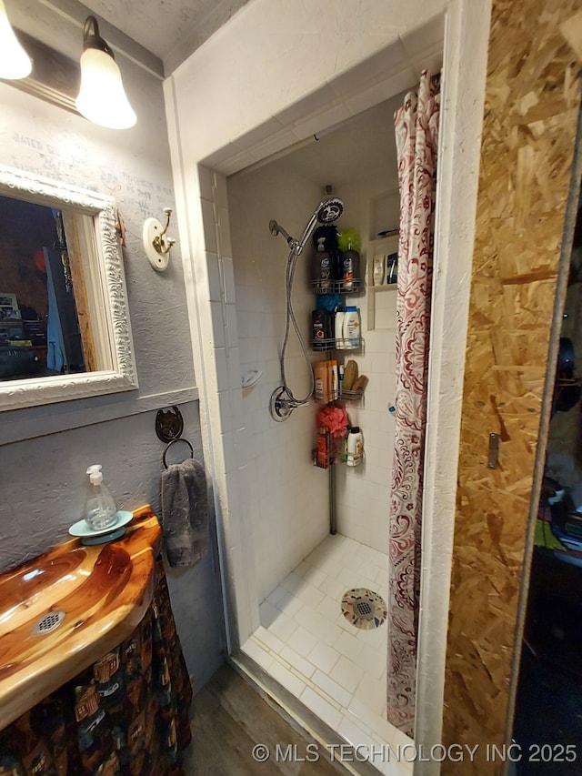 full bathroom with a stall shower