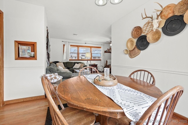 dining area with light hardwood / wood-style floors