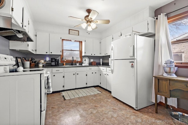 kitchen featuring white cabinetry, sink, white appliances, and ceiling fan