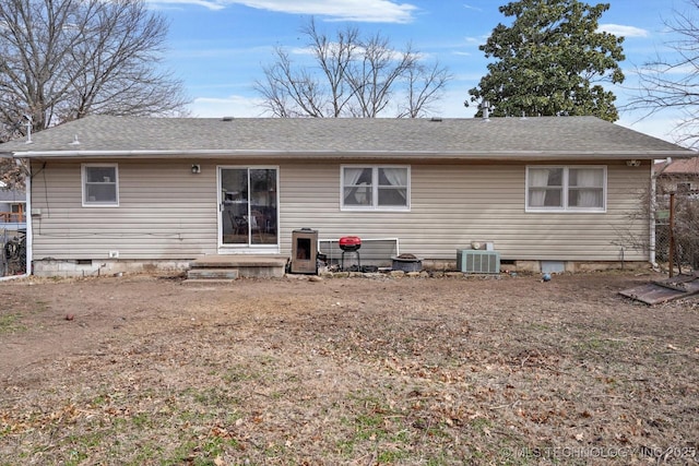 rear view of property with central air condition unit