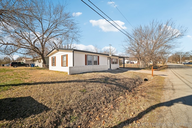 view of property exterior featuring a lawn