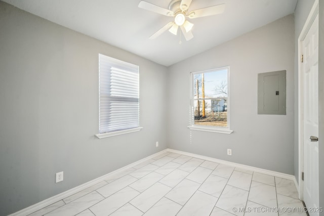 empty room with lofted ceiling, electric panel, and ceiling fan