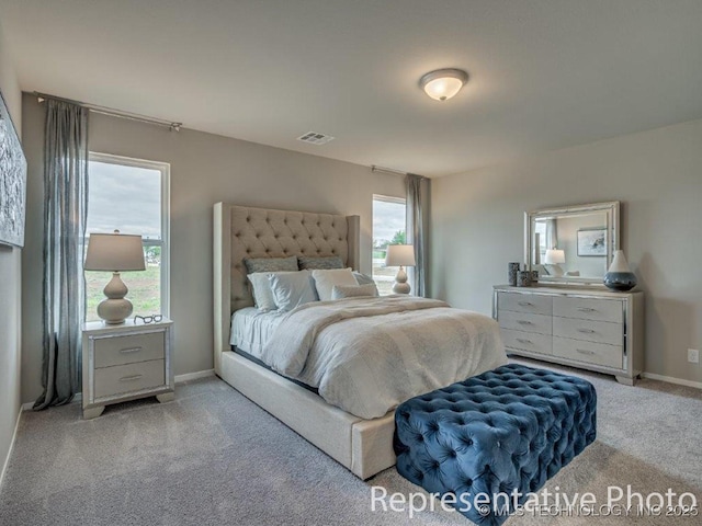 bedroom featuring light carpet