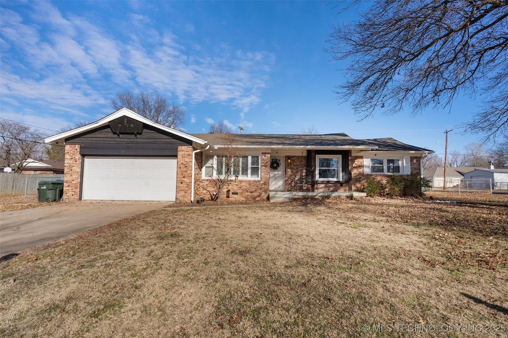 ranch-style house featuring a garage and a front yard