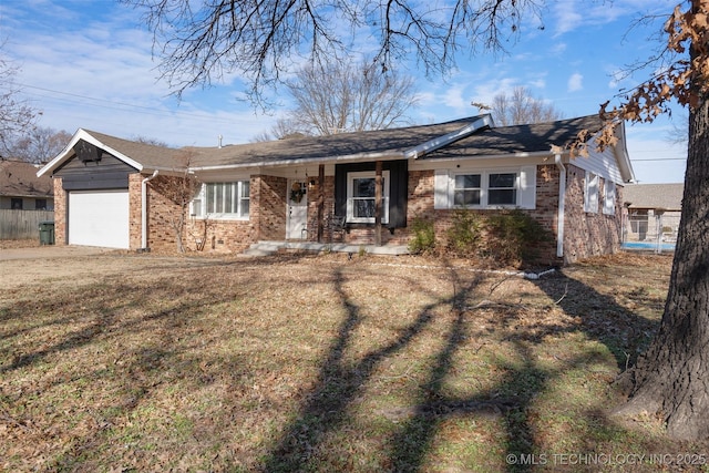 ranch-style home featuring a garage and a front yard