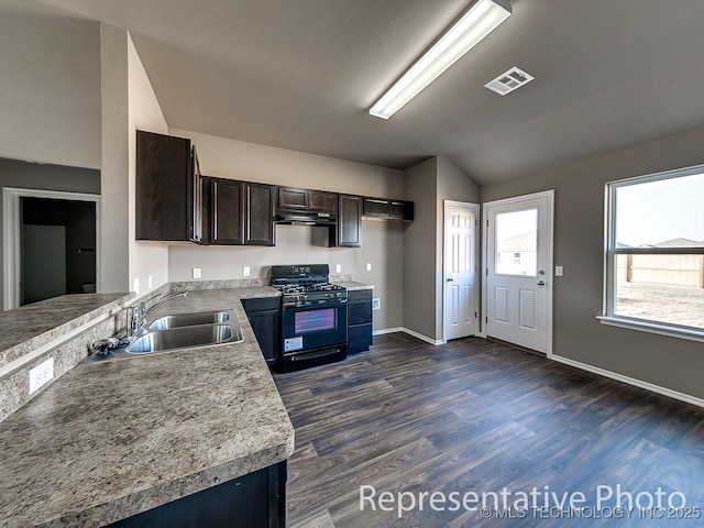 kitchen featuring sink, ventilation hood, dark brown cabinets, dark hardwood / wood-style flooring, and black gas stove