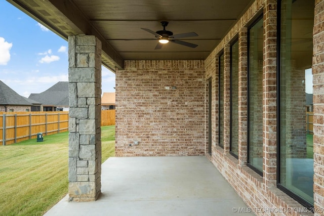 view of patio / terrace featuring fence and a ceiling fan