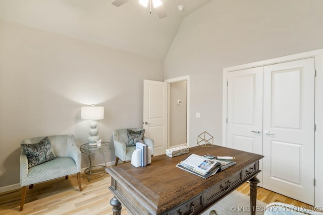 office with high vaulted ceiling, baseboards, ceiling fan, and light wood finished floors