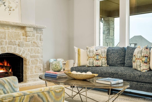 living area with a warm lit fireplace