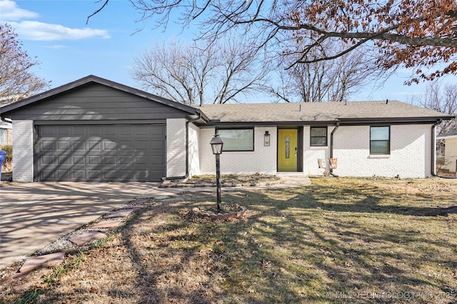 single story home with a garage and a front yard