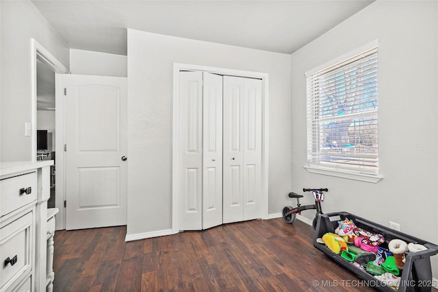 recreation room with dark hardwood / wood-style flooring