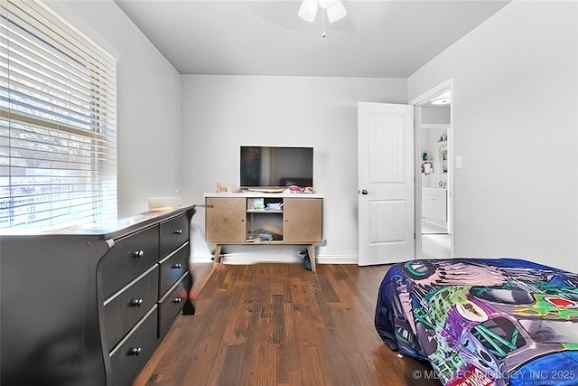 bedroom with ceiling fan and dark hardwood / wood-style flooring