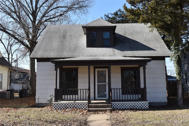 view of front of home featuring covered porch and central air condition unit