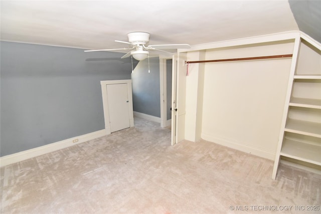 additional living space featuring lofted ceiling, light colored carpet, and ceiling fan