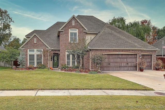 view of front of house featuring a garage and a front yard