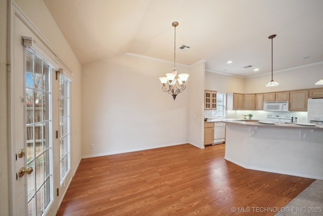 kitchen with pendant lighting, light brown cabinetry, white appliances, and light hardwood / wood-style flooring