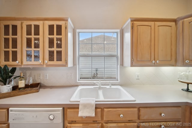 kitchen featuring tasteful backsplash, white dishwasher, sink, and light brown cabinets