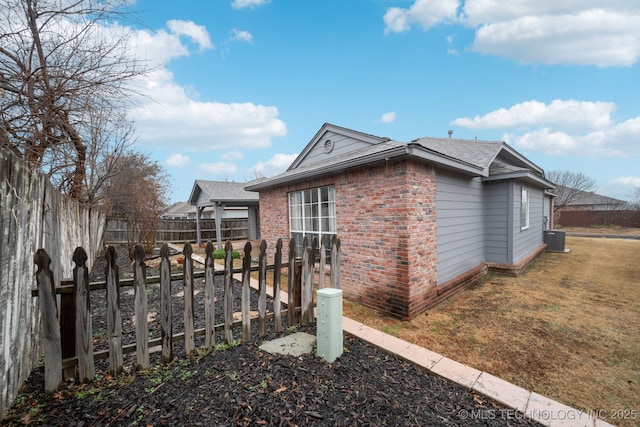 view of home's exterior featuring central AC unit