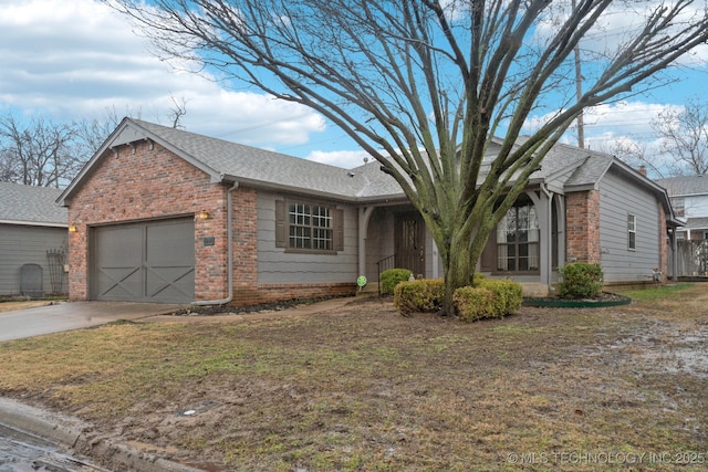 single story home featuring a garage and a front lawn