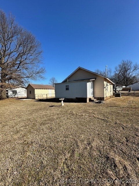 view of property exterior with a lawn