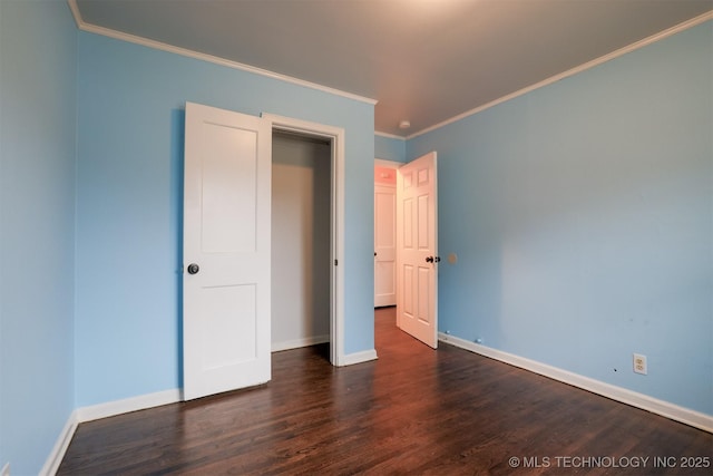 unfurnished bedroom with dark wood-type flooring and ornamental molding