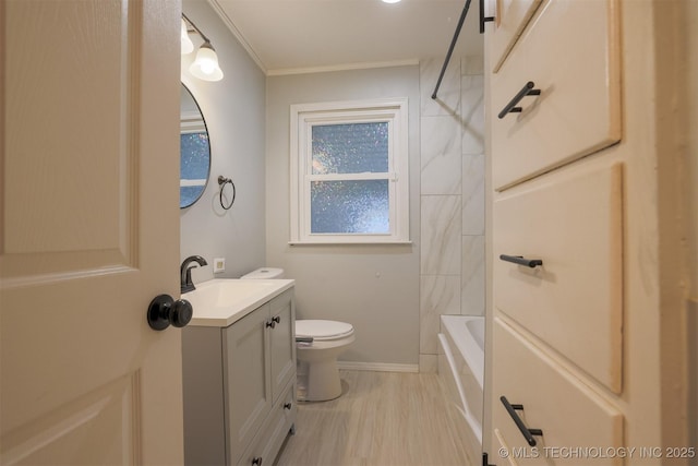 full bathroom featuring tiled shower / bath, vanity, toilet, and ornamental molding