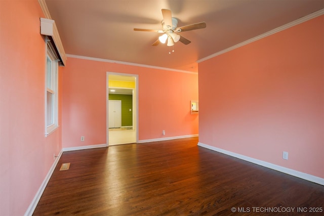 empty room featuring dark hardwood / wood-style flooring, crown molding, and ceiling fan