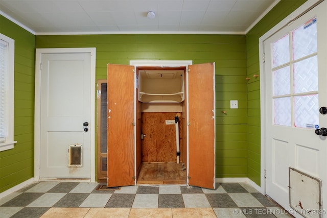 interior space featuring wooden walls