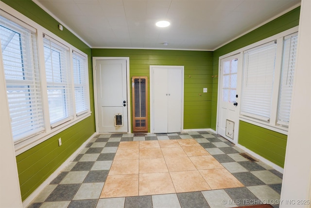 entrance foyer with wood walls