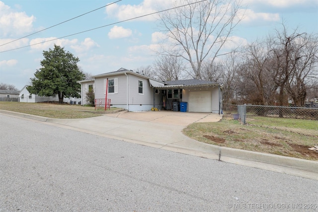 view of front of home featuring a garage and a front lawn