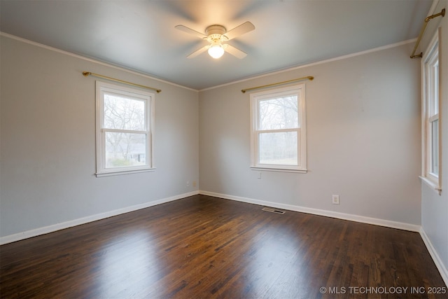 spare room with crown molding, ceiling fan, and dark hardwood / wood-style flooring