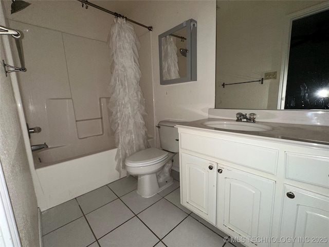 full bathroom featuring toilet, vanity, tile patterned floors, and shower / tub combo with curtain