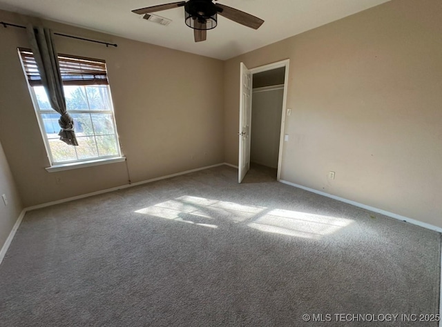 unfurnished bedroom featuring carpet floors and ceiling fan