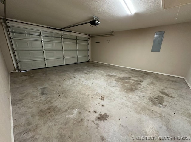 garage featuring a garage door opener and electric panel