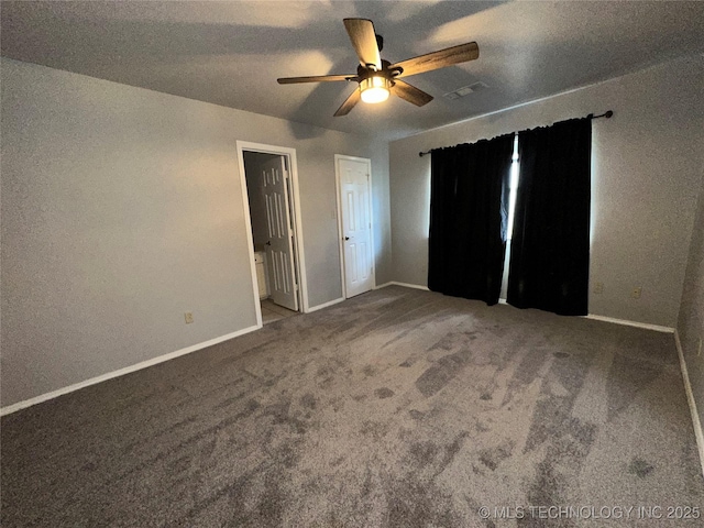 310 Northridge, Durant, OK 74701 - unfurnished bedroom featuring baseboards, carpet, ceiling fan, and ensuite bath