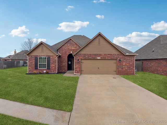 ranch-style house featuring a garage and a front lawn