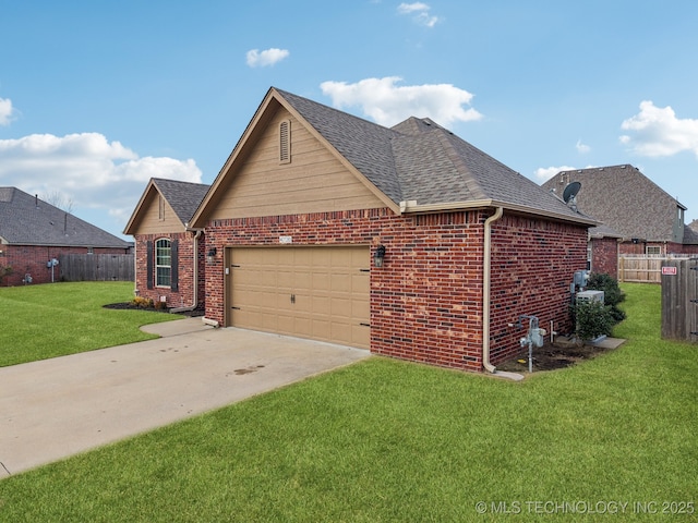 view of front of home featuring a garage and a front lawn