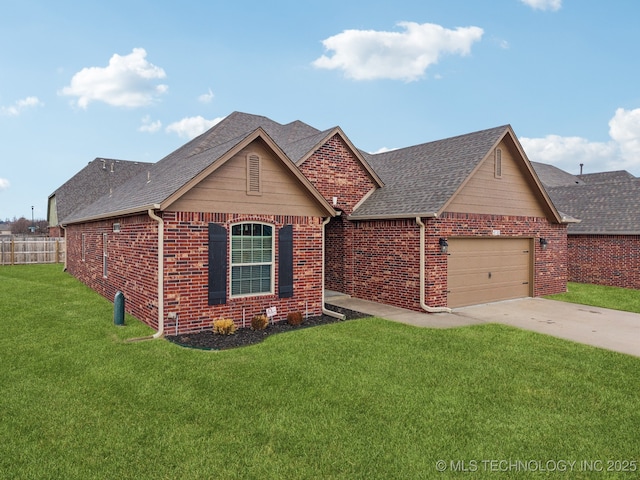 view of front of property with a garage and a front lawn