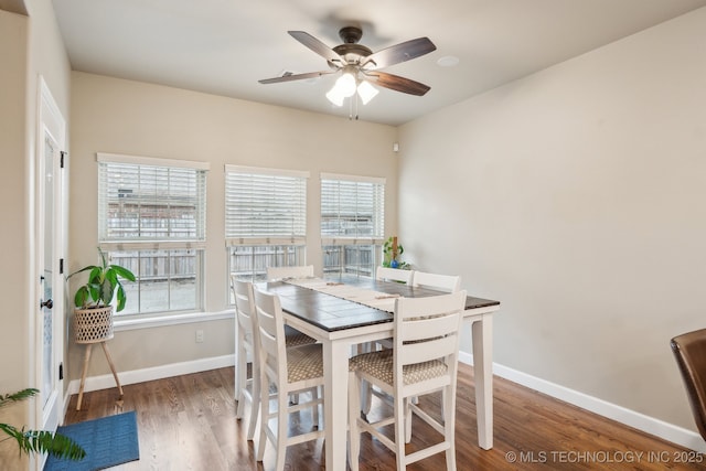 dining space featuring dark hardwood / wood-style floors and ceiling fan