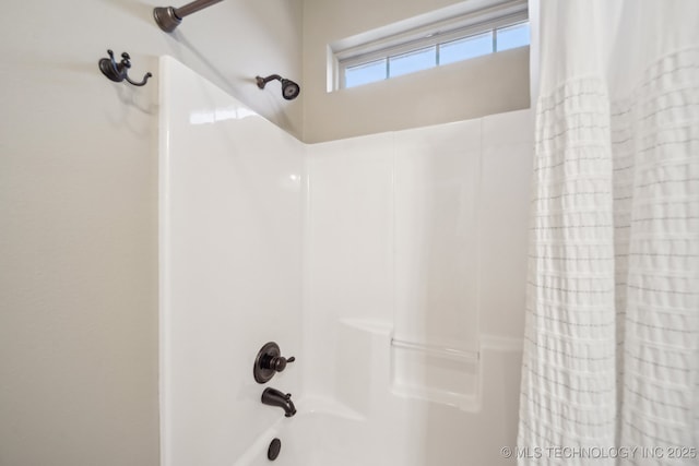 bathroom featuring shower / bathtub combination with curtain