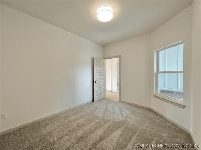 empty room with carpet flooring