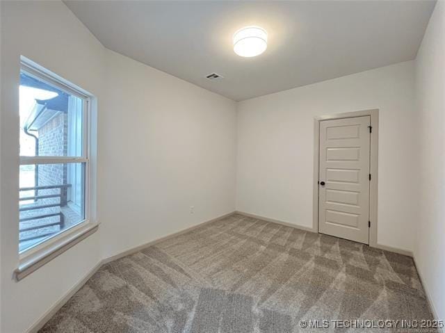 view of carpeted spare room