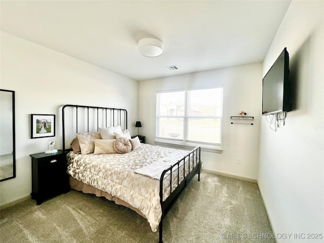 bedroom with light carpet