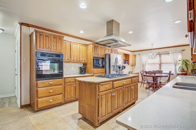 kitchen with pendant lighting, crown molding, island range hood, black appliances, and a kitchen island