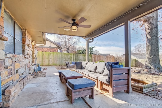 view of patio / terrace featuring ceiling fan and an outdoor living space