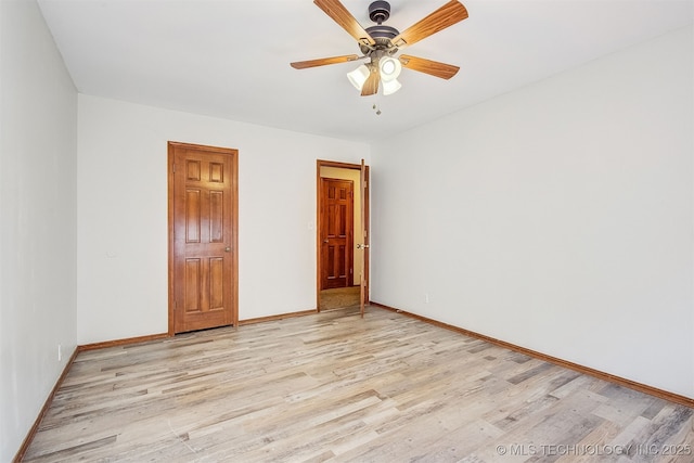 unfurnished bedroom with ceiling fan and light hardwood / wood-style floors