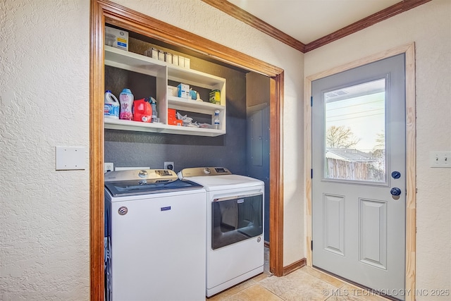 laundry room with ornamental molding, separate washer and dryer, and light tile patterned floors