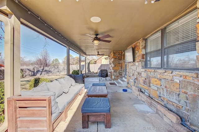 view of patio with outdoor lounge area and ceiling fan