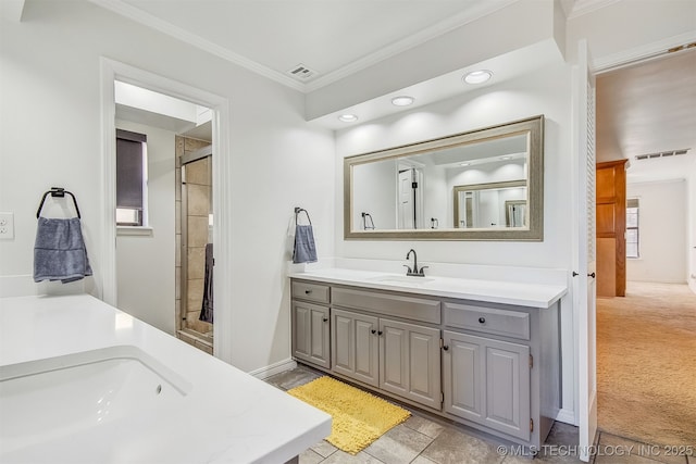 bathroom with ornamental molding and vanity