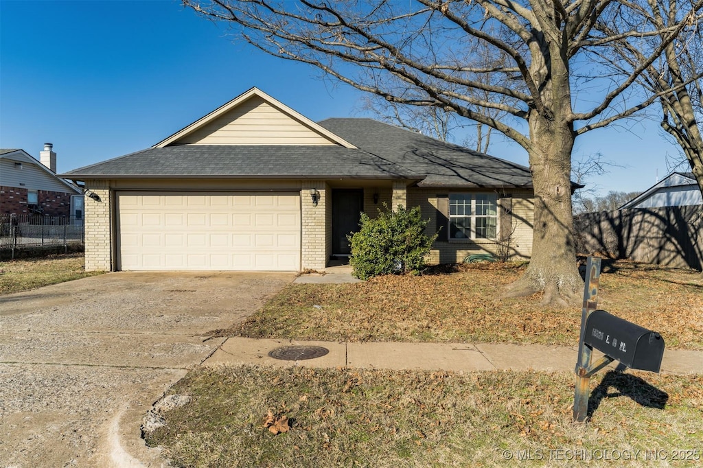 single story home featuring a garage